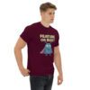Maroon t-shirt with Feature or Bug software engineer humor design and cute bug graphic